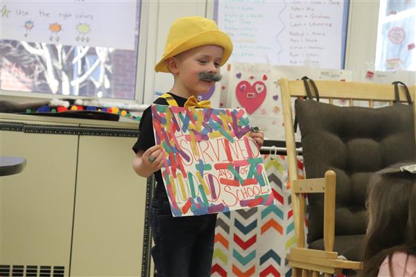  Student from Mrs. Perlet's classroom shows off his 100 days project