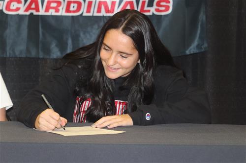 Adria Ariola signs